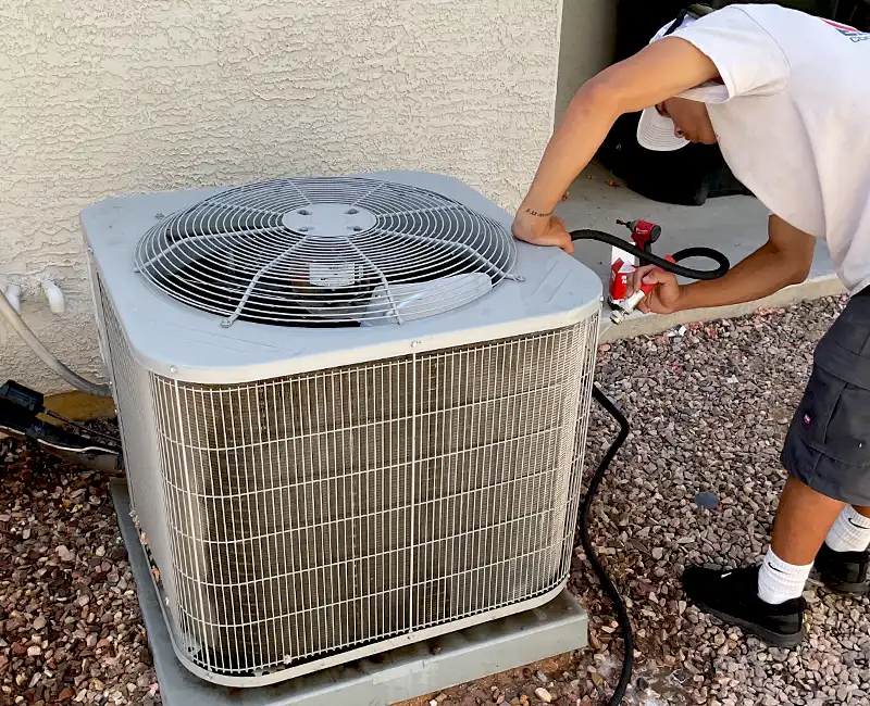 Eagle Air Tech Diagnosing an AC Unit in Mesa, AZ